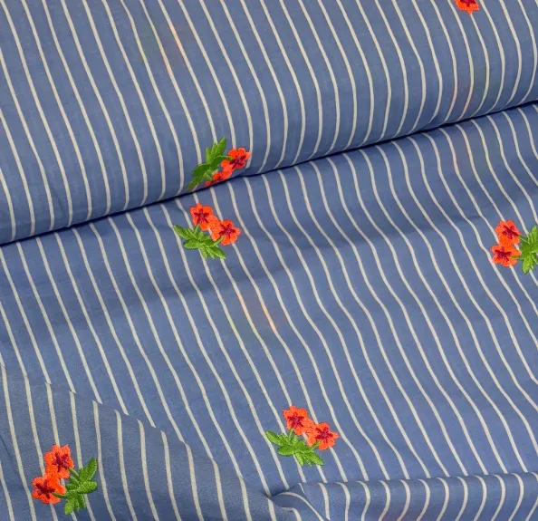 Broderie blauw gestreept met neon bloemen